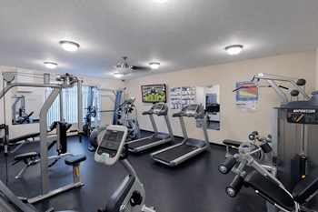 Fitness center with treadmills and weight machines